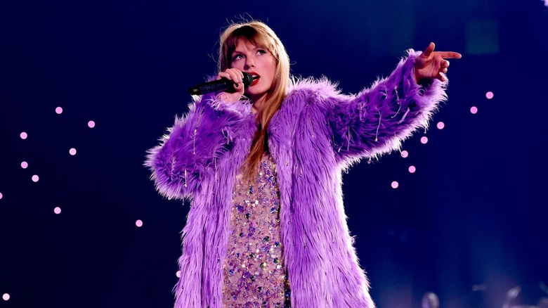 Taylor Swift Eras Tour film purple jacket 